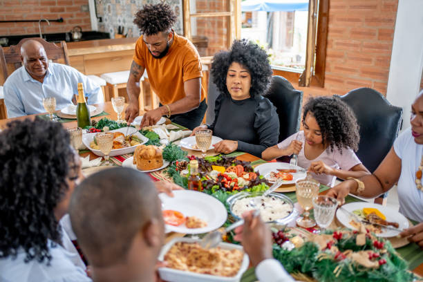 istock Family together for Christmas lunch 1447011235
