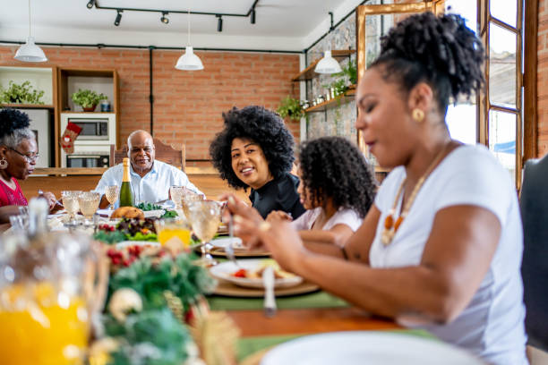 istock Family together for Christmas lunch 1447011338