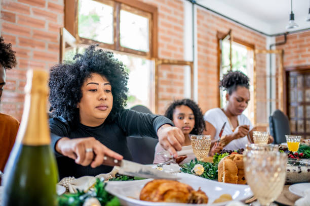 istock Family together for Christmas lunch 1447011396
