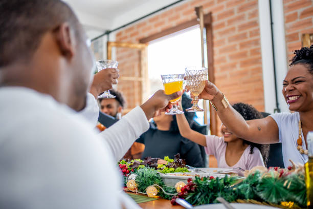 istock Family toasting Christmas dinner at home 1447011416