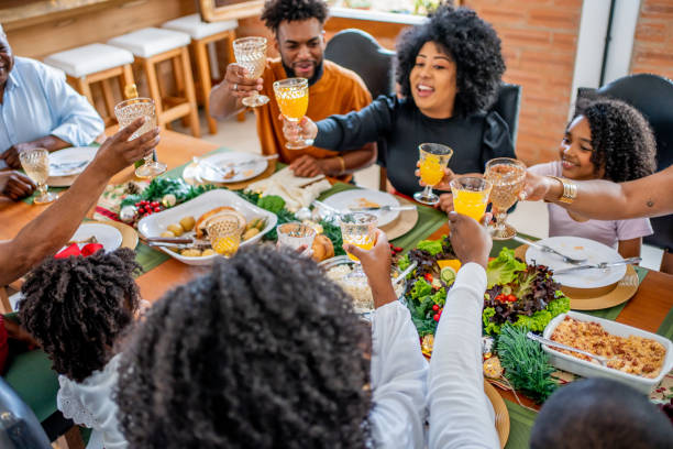 istock Family toasting Christmas dinner at home 1447011433