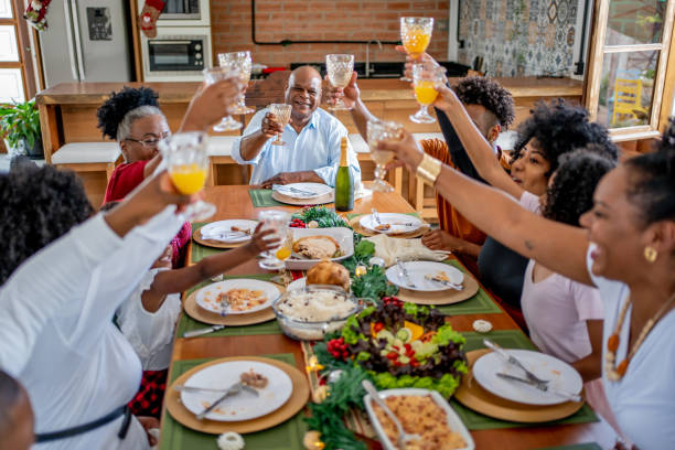 istock Family toasting Christmas dinner at home 1447011454
