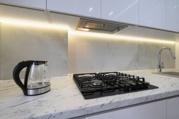 istock White modern kitchen with a gas stove and glass electric kettle 1447012457