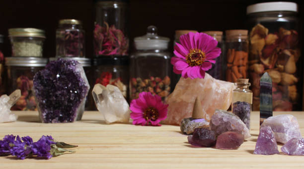 istock Amethyst Crystals and Flowers On Meditation Table 1447012864