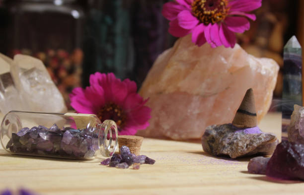 istock Amethyst Crystals With Flowers and Incense Cone on Meditation Table 1447013035