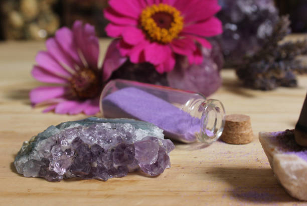 istock Amethyst Crystals With Flowers and Incense Cones on Meditation Table 1447013386