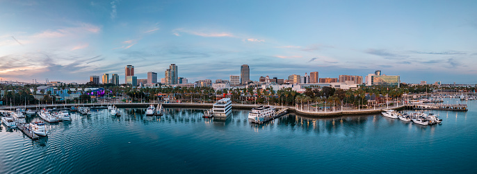 Long Beach shoreline Marina with a view of the city and cloudscape in the background.