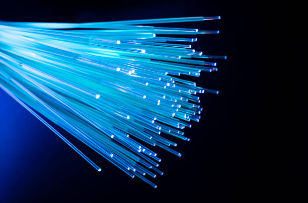 Fiber optical cables fiber optics network cable for ultra fast internet communications, thin light threads that move information at high speed. computer cable stock pictures, royalty-free photos & images