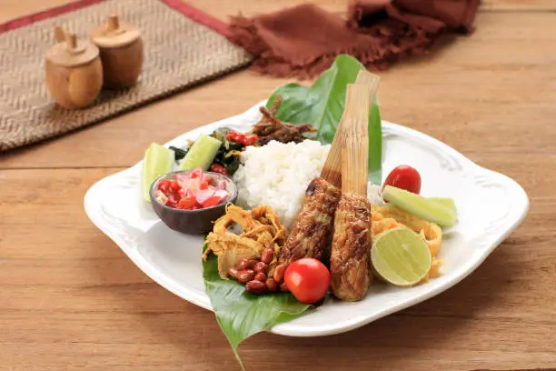 Photo of Balinese Mixed Rice, Indonesian Balinese Rice with Sate Lilit, Ayam Sisit, Sambal Matah, and Peanut