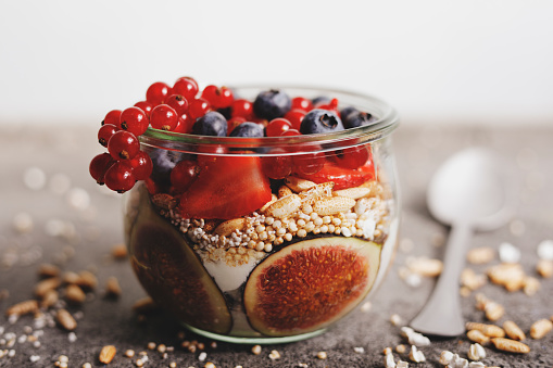 Healthy breakfast with fruit, puffed rice and quinoa