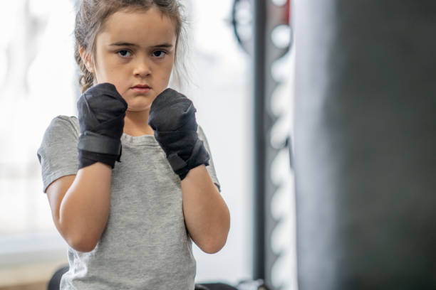 istock Girl trains in boxing 1447028828