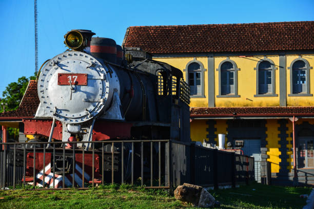 An old locomotive and the historic train station of the Madeira-Mamoré Railway, in Guajará-Mirim stock photo