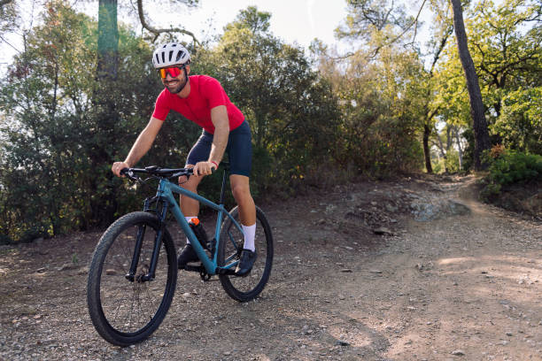 istock happy cyclist training with his mountain bike 1447030376