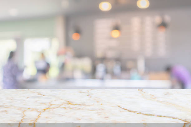 istock marble table top with blurred kitchen cafe restaurant interior background 1447031084