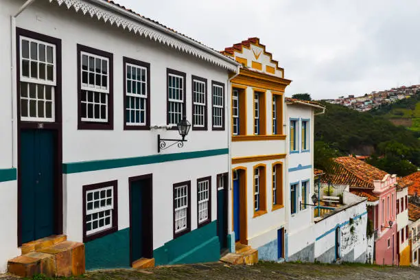 An overcast afternoon on a steep street in the historic, World Heritage-listed Ouro Preto colonial town, Minas Gerais state, Brazil