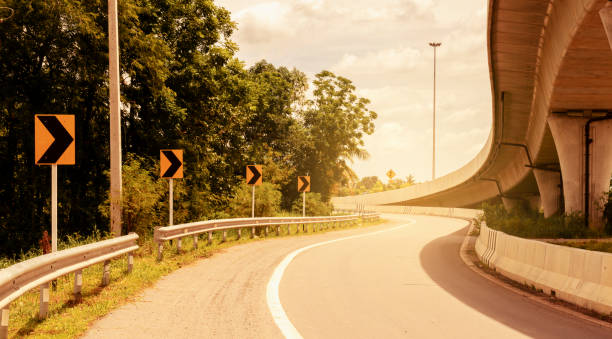 istock Yellow road sign on highway road 1447033258
