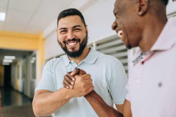 partner friends shaking hands - friends bildbanksfoton och bilder