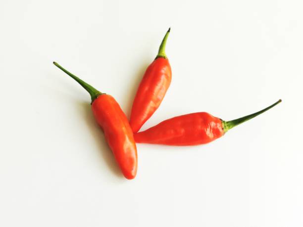 istock a bunch of indonesian red cayenne peppers (chilli) on a white background 1447041410