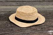 istock Brown hat on a old wooden surface 1447042609
