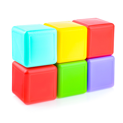 Colorful plastic cubes for children. Different geometric shapes isolated on a white background.