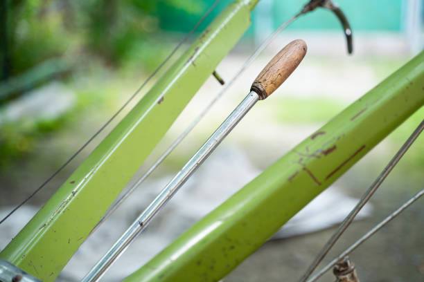 Gear lever on a walk-behind tractor close-up on a blurred background. Control elements of agricultural machinery. Rototiller connection and gear shifting
