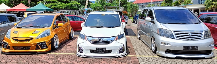 Batu City, East Java Province, Indonesia - December 2022 : Three cars in a sport stance modified lined up in the Automotive Contest