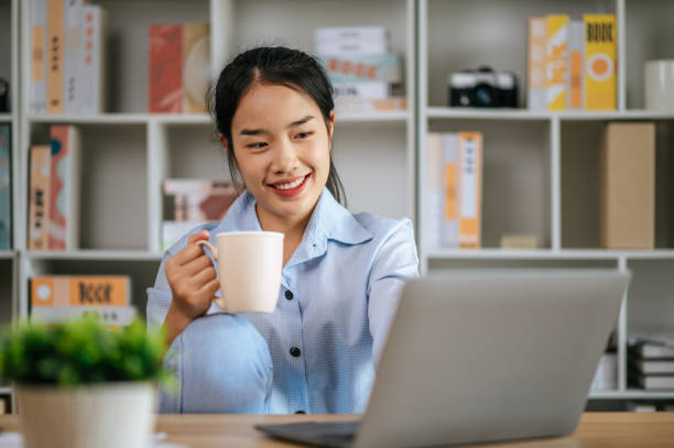 istock Young woman working at home with laptop computer 1447048872