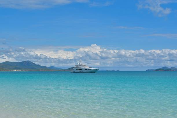 Luxury white yacht near Whitsunday Island. stock photo