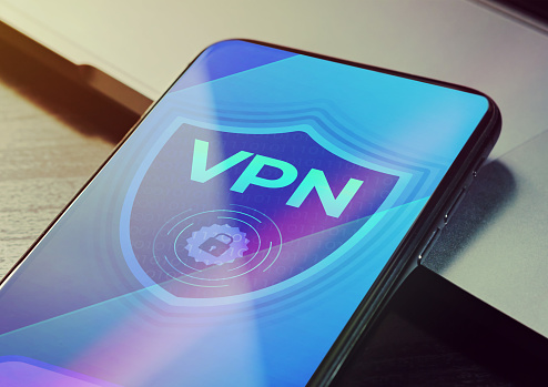 VPN - Virtual private network application for encrypt connection, anonymous internet using and unblock websites. Close up vpn security network sign logo on the smartphone screen.