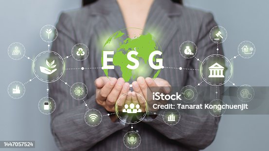istock Hand holding a green globe in the concept of nature about management esg, sustainability, ecology and renewable energy for save the world environmental and conservation 1447057524