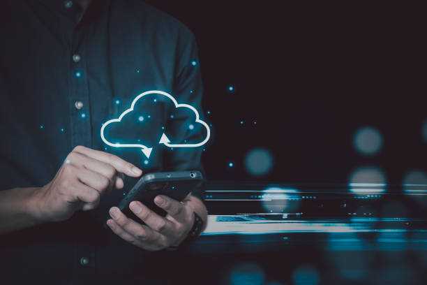 istock Businessman holding smartphone technology digital with cloud computing icon.Business Cloud computing concept . 1447060499
