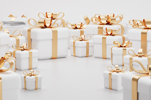 Gold gift boxes with red ribbon on white. This file contains 