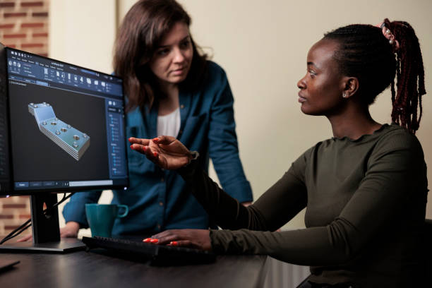 istock 3D digital artist collaborating with colleague in order to solve technical difficulties. 1447070728