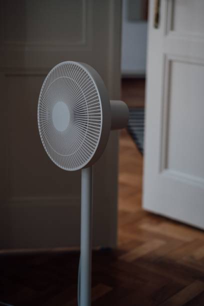 istock White standing fan in a room 1447072768