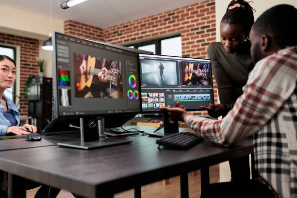 istock African american professional video editors enhancing digital footage using specialized software. 1447073048