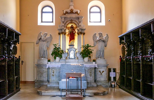 Porec, Croatia – June 20, 2022: An old Euphrasian basilica altar with the Christ statue in Porec, Croatia