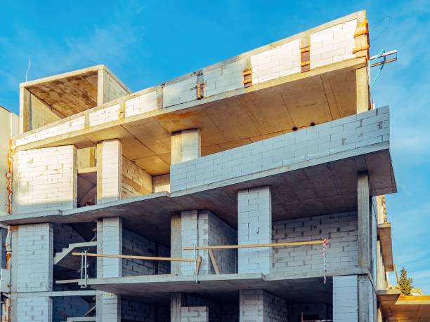 istock Apartment building against a blue sky under construction 1447073548