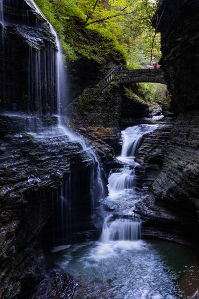 istock Small waterfall with a stream and big rocks 1447074224