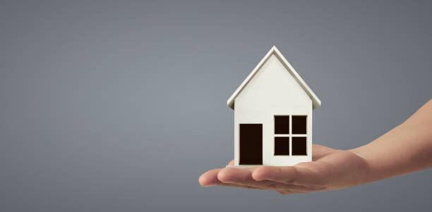 istock House Residential Structure in  hand ,business home idea 1447074544
