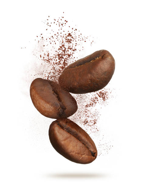 istock Aromatic ground coffee and beans falling on white background 1447074603