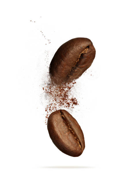 istock Aromatic ground coffee and beans falling on white background 1447074652