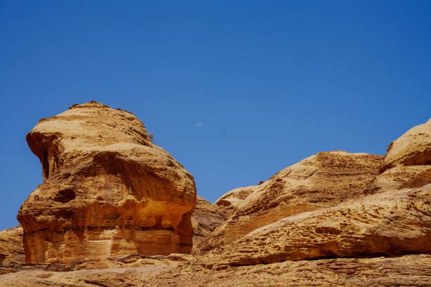 istock Sandstone rock formations at Wadi Rum valley in Jordan against a blue sky 1447075266