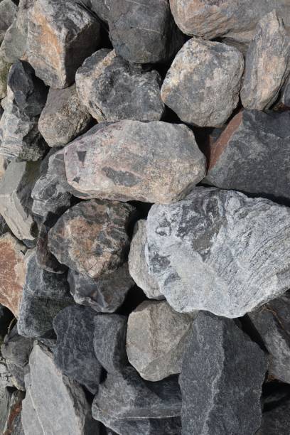 istock Vertical shot of a grey rough rock background 1447075462