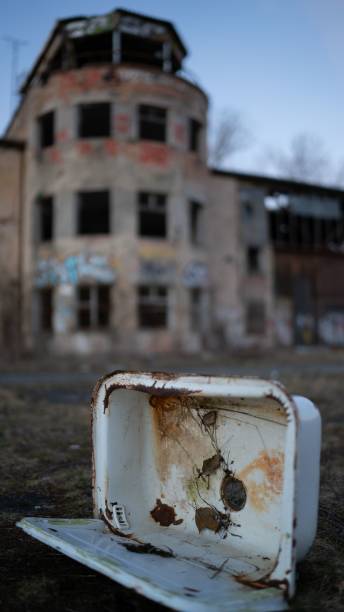 istock Vertical shot of an abandoned building with a broken roof 1447075504