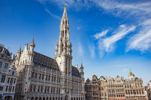 Brussels Town Hall building with tall spire and other guild houses in the Grand Place in Brussels, Belgium