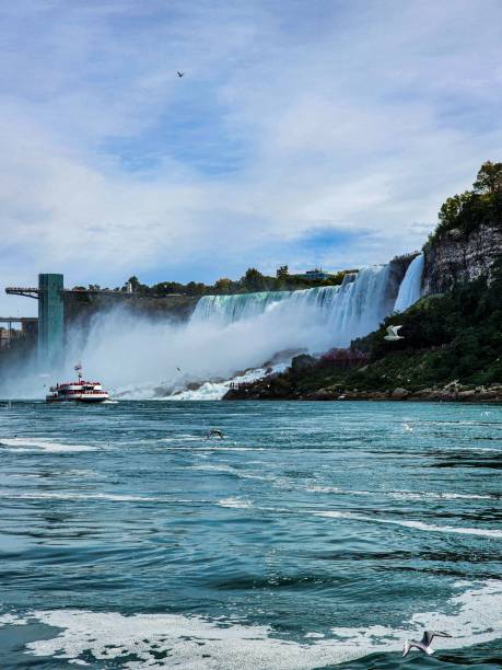 istock Boat passing by the raging dam with big waves 1447075885