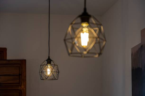 istock Black pendant lamp shade hanging on the ceiling 1447076491