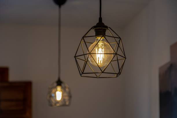 istock Black pendant lamp shade hanging on the ceiling 1447076495