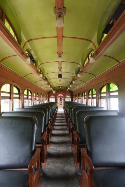 istock Vertical shot of an old bus interior with comfortable black seats 1447077092