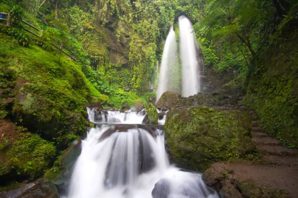 istock Closeup of beautiful Jumong Waterfall in rainforest located in Karanganyar, Central Java, Indonesia 1447078491